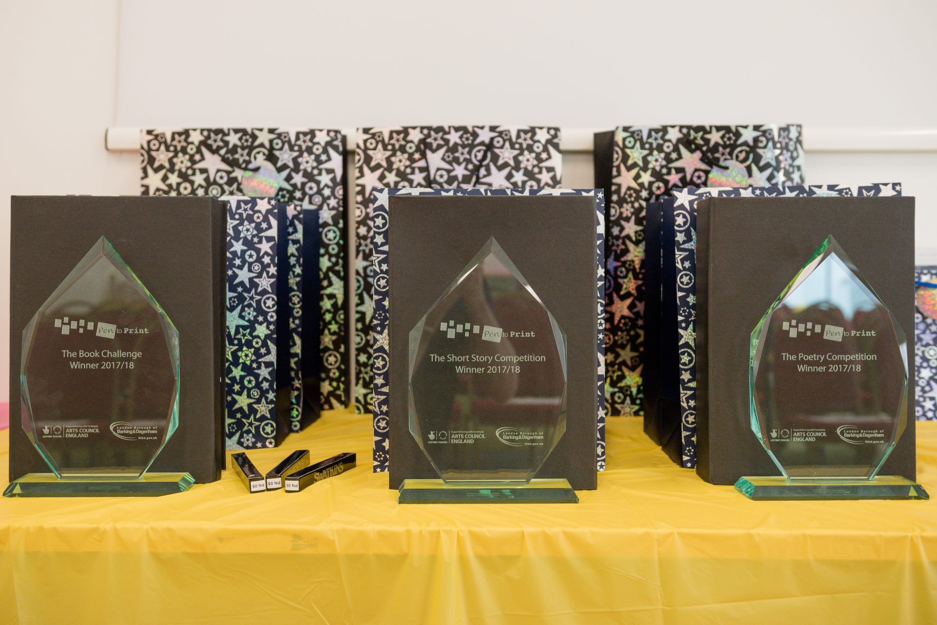 A row of Pen to Print trophies