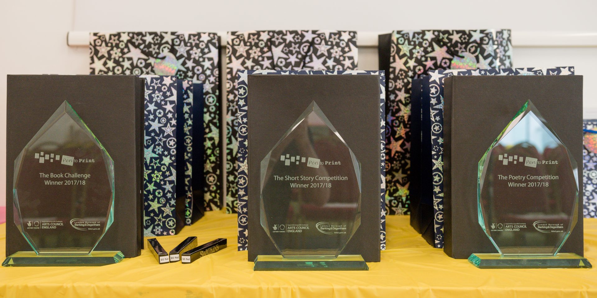 A row of Pen to Print trophies