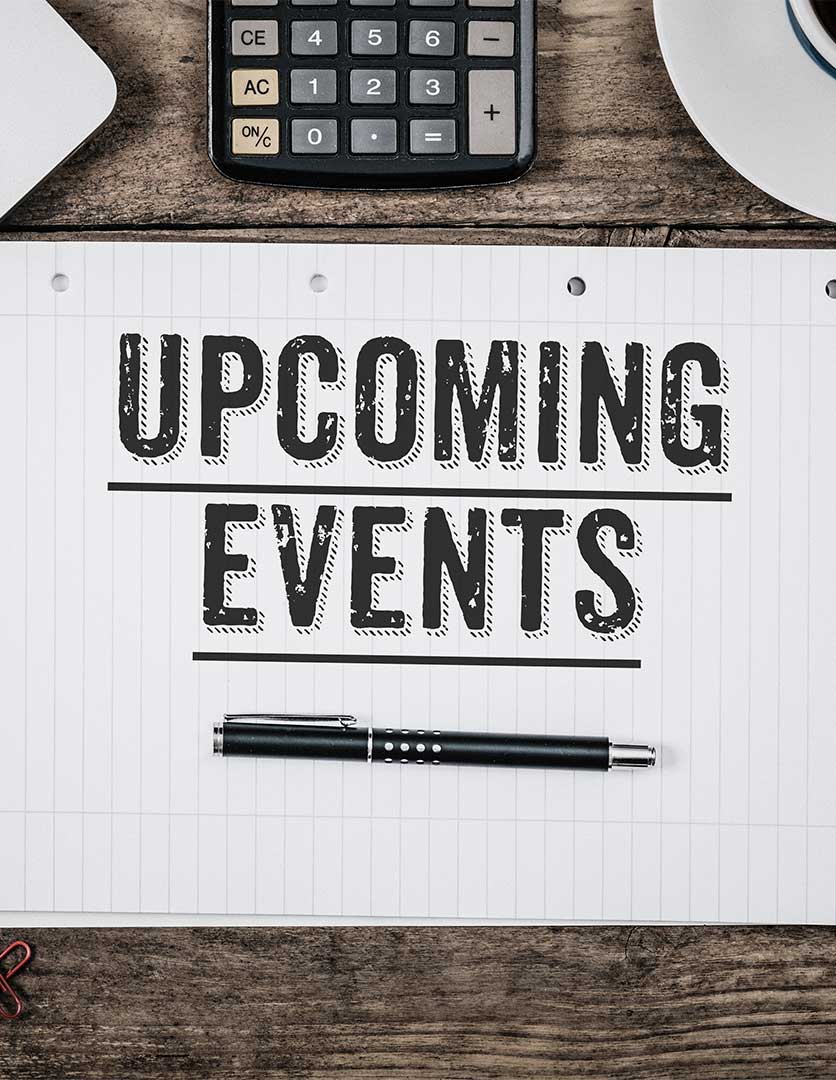 a keyboards and sheet of paper with a pen resting paper has caption Upcoming Events